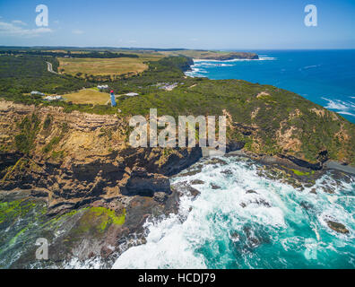 Aerial view of Cape Schanck Lighthose and waves crushing over rugged coastline. Mornington Peninsula, Victoria, Australia Stock Photo