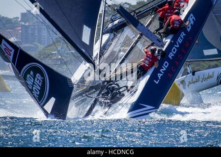 Sydney, Australia. 08th Dec, 2016. Land Rover BAR Academy (GBR), skippered by Neil Hunter (GBR) sailors scramble to hold on as the vessel capsizes on the waters of the Sydney Harbour in Australia. Credit:  Hugh Peterswald/Pacific Press/Alamy Live News Stock Photo