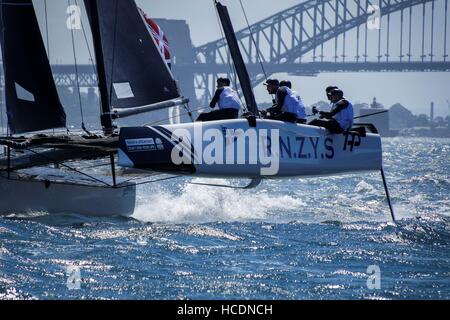 Sydney, Australia. 08th Dec, 2016. RNZYS Performance Programme (NZ), skippered by Chris Steele (NZ) racing down harbour just prior to capsizing on the waters of the Sydney Harbour in Australia. Credit:  Hugh Peterswald/Pacific Press/Alamy Live News Stock Photo