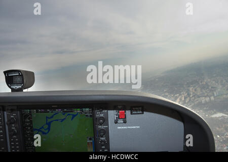 Kiev, Ukraine - November 12, 2010: View from the Cessna 172 Skyhawk during the flight over the city with cloudy weather conditions Stock Photo