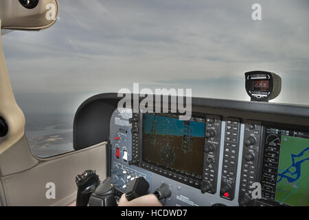 Kiev, Ukraine - November 12, 2010: View from the Cessna 172 Skyhawk cockpit during the flight over the city with cloudy weather conditions Stock Photo