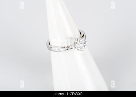 Diamond ring with gold and silver and precious stones. Shot standing up and from above. Stock Photo