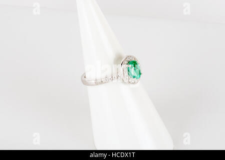 Diamond ring with gold and silver and precious stones. Shot standing up and from above. Stock Photo