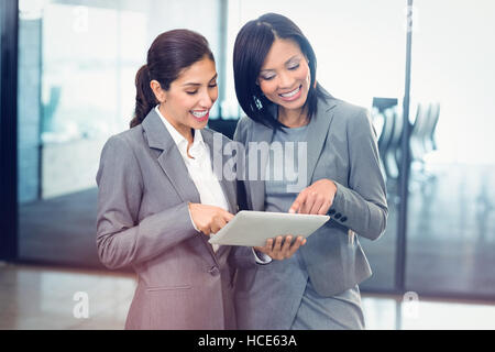 Businesswomen using digital tablet Stock Photo