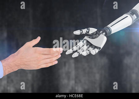 Composite image of businessman holding hand out in presentation Stock Photo