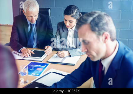 Business people in conference room Stock Photo