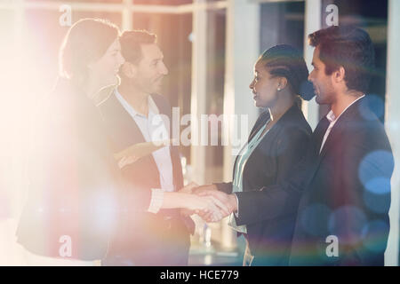 Side view of businesspeople shaking hands with each other Stock Photo