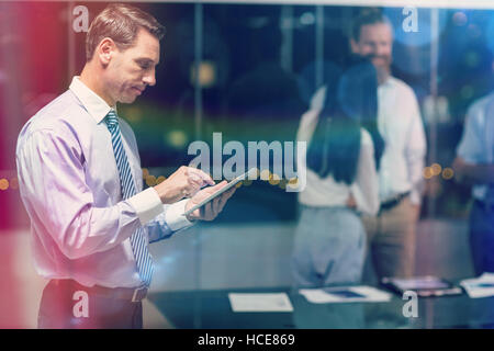 Businessman using digital tablet Stock Photo