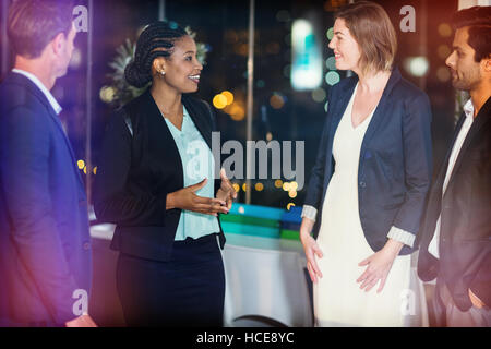 Group of businesspeople interacting with each other Stock Photo