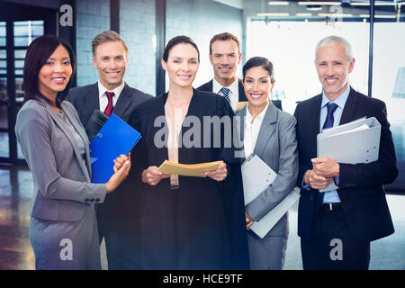 Portrait of lawyer standing together with business people Stock Photo