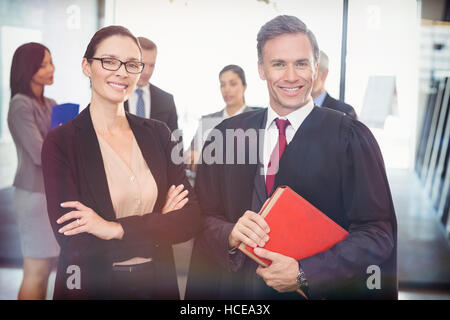 Portrait of businesswoman standing with lawyer Stock Photo