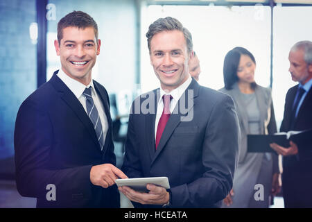Portrait of businessmen using digital tablet Stock Photo