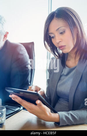 Attractive businesswoman using digital tablet Stock Photo
