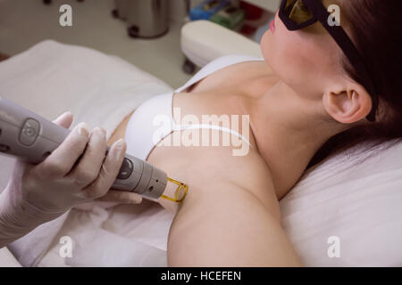 Female patient receiving laser hair removal treatment Stock Photo