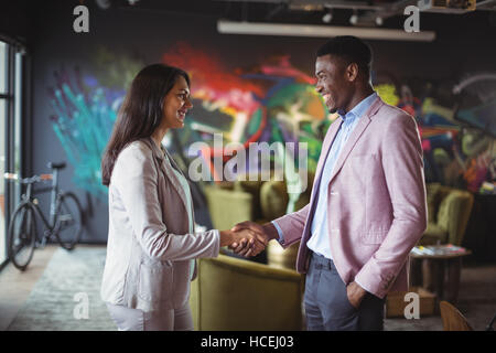 Businessman and a colleague shaking hands Stock Photo