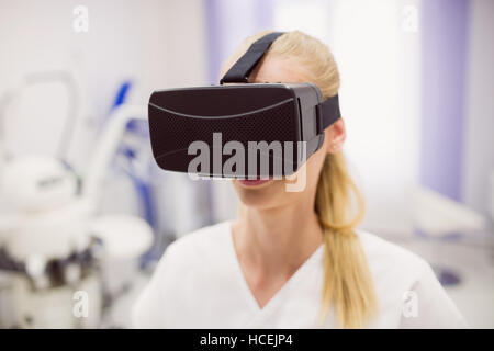 Female doctor wearing virtual reality headset Stock Photo