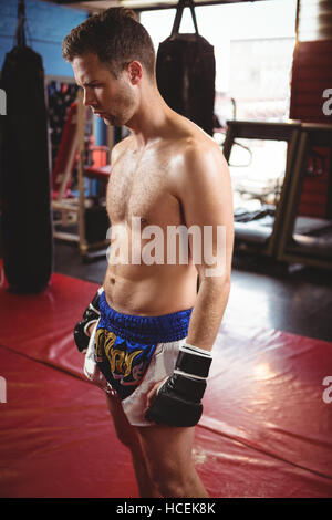 Boxer standing in fitness studio Stock Photo