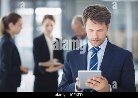 Businessman using digital tablet Stock Photo