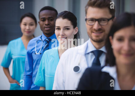 Team of doctors standing in row Stock Photo