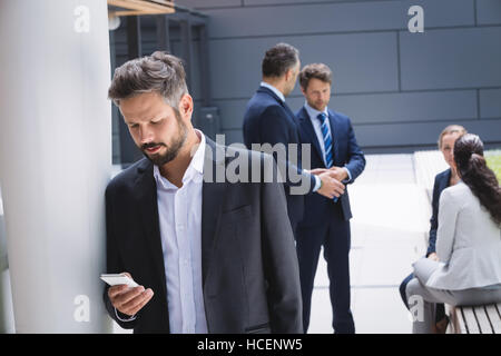 Businessman using mobile phone Stock Photo