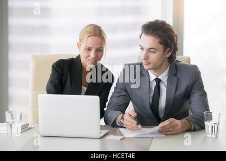 Two business people discussing work plans Stock Photo