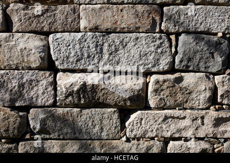 Granite block retaining wall Stock Photo
