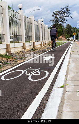 A man have an exercise by riding bicycle focus on symbol Stock Photo