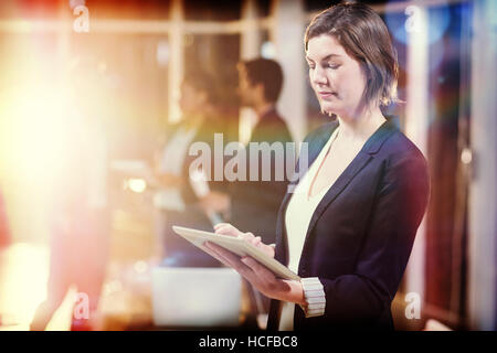 Side view of businesswoman using digital tablet Stock Photo