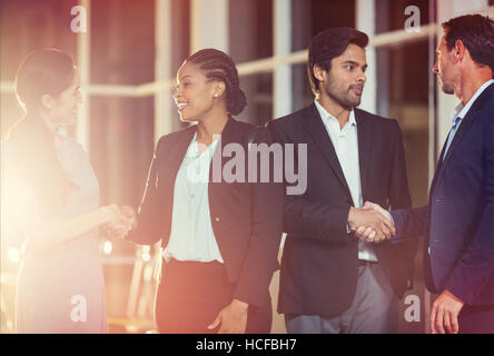Group of business people shaking hands with each other Stock Photo