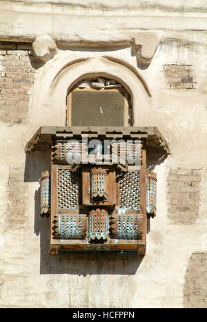 Wooden lattice of a balcony enclosure on a traditional Arabian building of old Sana on Yemen Stock Photo
