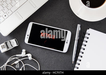 WROCLAW, POLAND- DECEMBER 06th, 2016: LG K10 with Netflix application laying on desk. Netflix provides streaming media and video Stock Photo