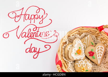 Happy Valentines day calligraphy card with heart shaped cookies Stock Photo