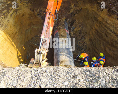 Works on the dug-out oil pipeline. Construction of the oil pipeline. Stock Photo