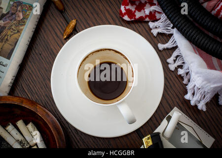 after coffee Jordanian morning with news paper and cigarette Stock Photo