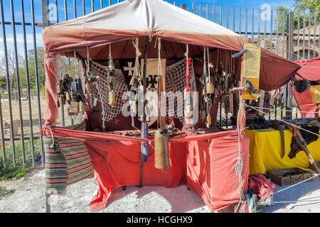 outdoor scene with a cowbells shop in the recreation of a medieval market. the market have free admission and is located on a public place Stock Photo