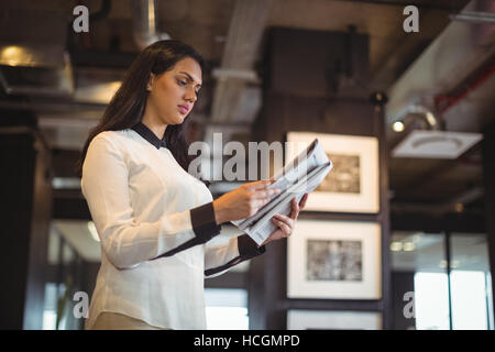 Businesswoman reading document Stock Photo