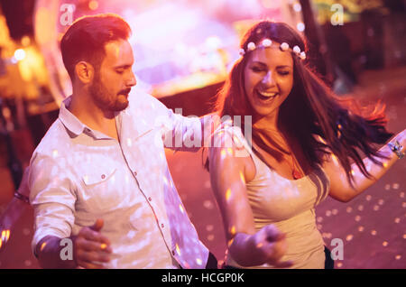 Happy couple dancing in club Stock Photo