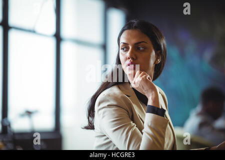 Thoughtful businesswoman looking away Stock Photo