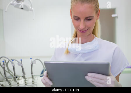 Female dentist using a digital tablet Stock Photo