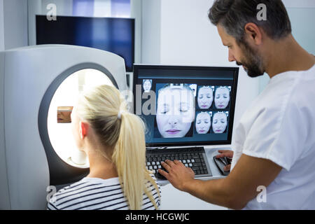 Woman receiving aesthetic laser scan Stock Photo