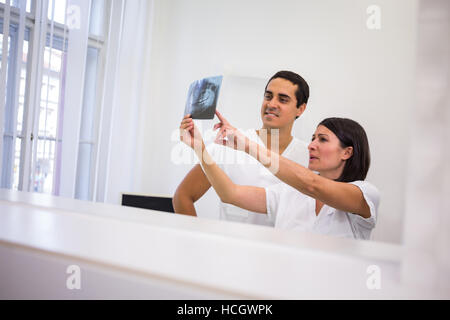 Dentists discussing over dental x-ray report Stock Photo