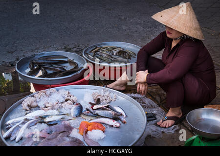 A woman selling fresh fish on the streets of Can Tho in the Mekong Delta region of Vietnam Stock Photo