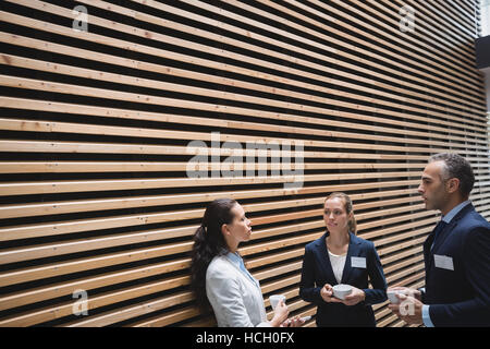 Businesspeople having a discussion during breaktime Stock Photo