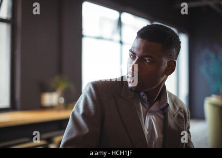 Thoughtful businessman looking away Stock Photo