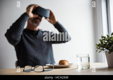 Man using virtual reality headset Stock Photo