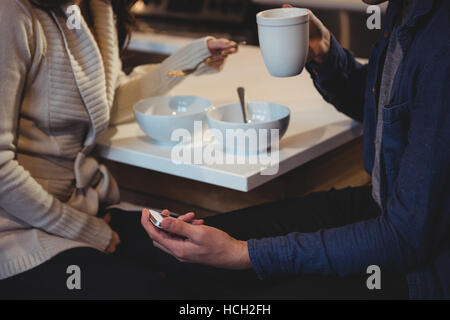 Couple having breakfast together in the kitchen Stock Photo