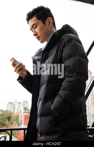 Man using mobilephone Stock Photo