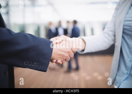 Businesspeople shaking hands Stock Photo