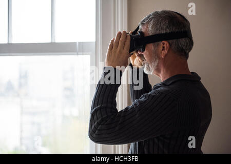Man using virtual reality headset Stock Photo