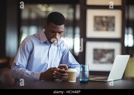 Businessman using mobile phone Stock Photo